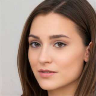 Close-up portrait of a young woman with brown hair and natural makeup.
