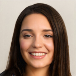 Smiling young woman with long brown hair against a plain background.