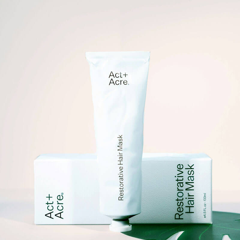 Act+Acre Restorative Hair Mask tube and box on light background.