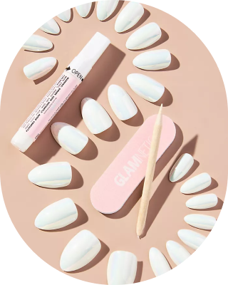 Set of white press-on nails with nail care tools on a beige background.