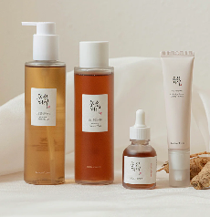 Elegant skincare products in minimalist packaging on a soft background.